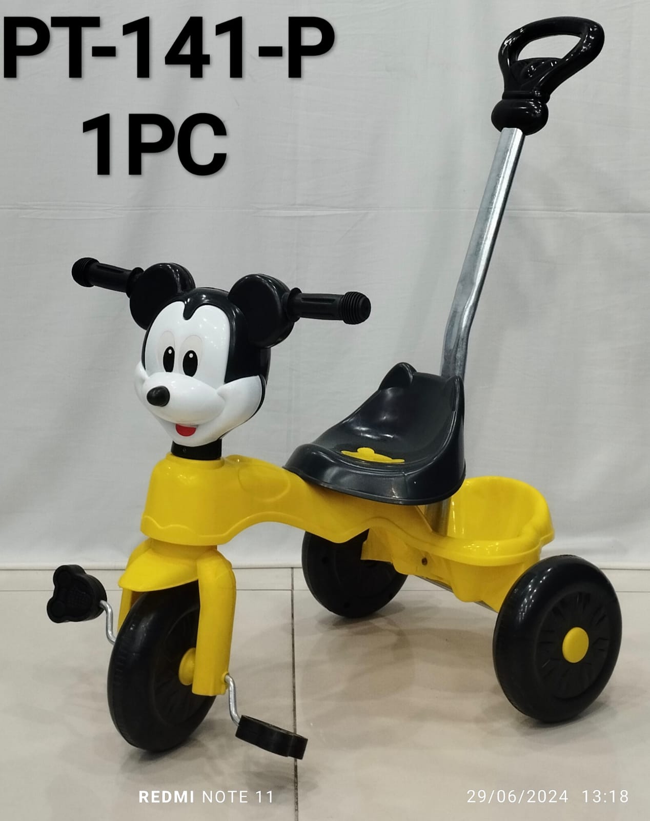 Kid's tricycle with push handle